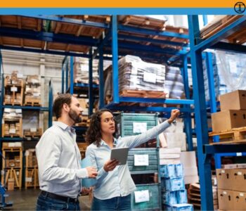 Warehouse supervisor with clipboard training a new hire in a Richmond VA facility
