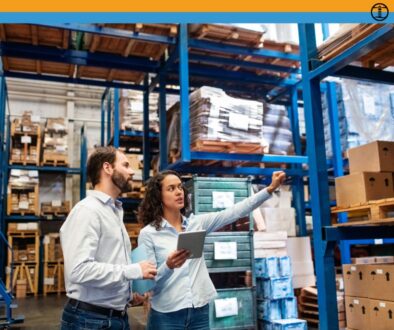 Warehouse-Supervisor-Mentoring-Employee-Richmond Warehouse supervisor with clipboard training a new hire in a Richmond VA facility