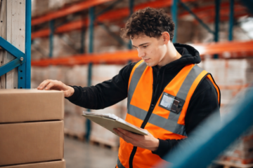 warehouse associate picking and packing orders in distribution center
