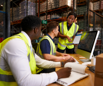 Warehouse leaders reviewing summer workforce planning and staffing needs.