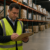 Warehouse supervisor reviewing staffing performance on the warehouse floor