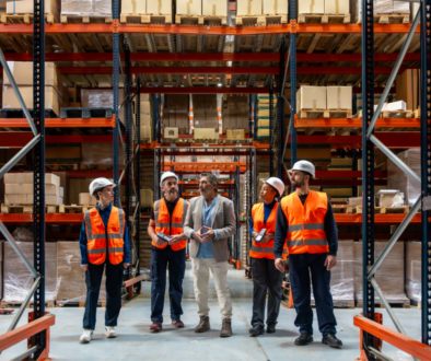Staffing professional touring a Virginia manufacturing warehouse with supervisors and warehouse employees.