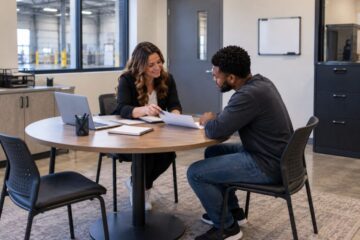 Staffing coordinator meeting with a candidate to review a job opportunity