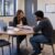 Staffing coordinator meeting with a candidate to review a job opportunity