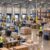Wide view of employees working inside an active warehouse and manufacturing facility.